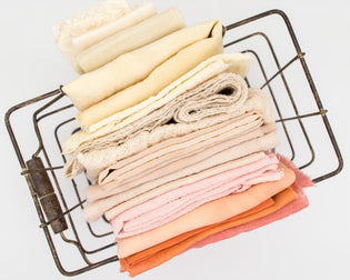  numerous fabric for baby clothes in a basket